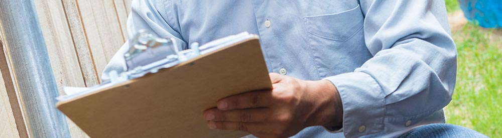 Restoration Expert holds clipboard checklist